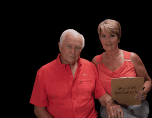 Two people in matching orange shirts.